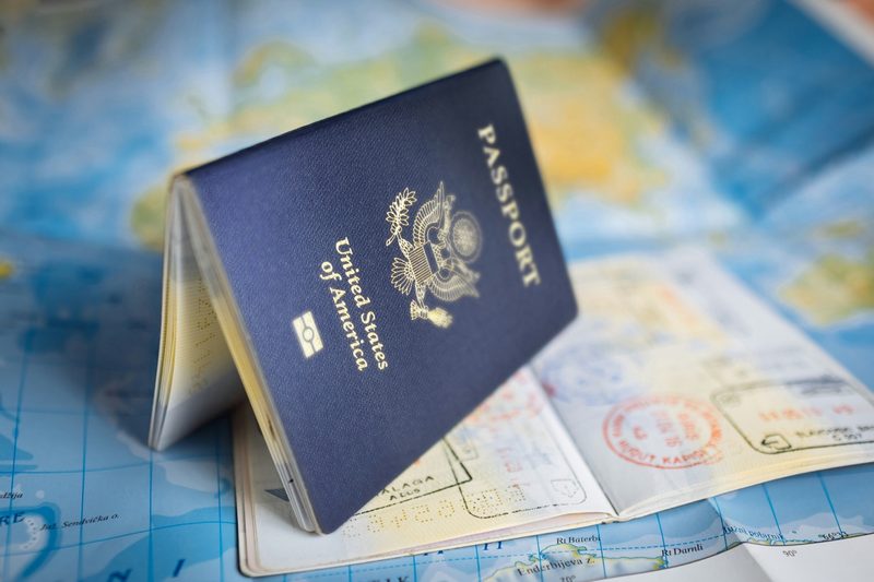 Passport with stamps on a world map